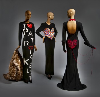 Left: Woman's Ensemble: Coat and Dress, Fall/Winter 1986. Patrick Kelly, American (active Paris), c. 1954 - 1990. Coat: Printed rayon twill. Dress: Wool and spandex knit, plastic buttons. Promised gift of Bjorn Guil Amelan and Bill T. Jones. Center: Woman's Dress, Fall/Winter 1986. Patrick Kelly, American (active Paris), c. 1954 - 1990. Wool and spandex knit, plastic. Promised gift of Bjorn Guil Amelan and Bill T. Jones. Right: Woman's Dress and Gloves, Fall/Winter 1988. Patrick Kelly, American (active Paris), c. 1954 - 1990. Dress: Wool knit, acetate faille, cotton embroidery. Promised gift of Bjorn Guil Amelan and Bill T. Jones. Gloves: Wool knit, plastic. Purchased with the Costume and Textiles Revolving Fund, 2012.