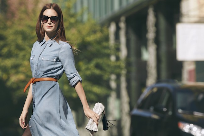 Location-Model-wearing-light-denim-shirt-dress-with-leather-belt